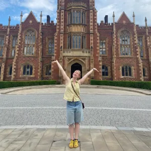 Abi Bowering ’24 in front of a castle-like building