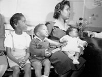 Woman and children at Birth Control Clinical Research Bureau, n.d.