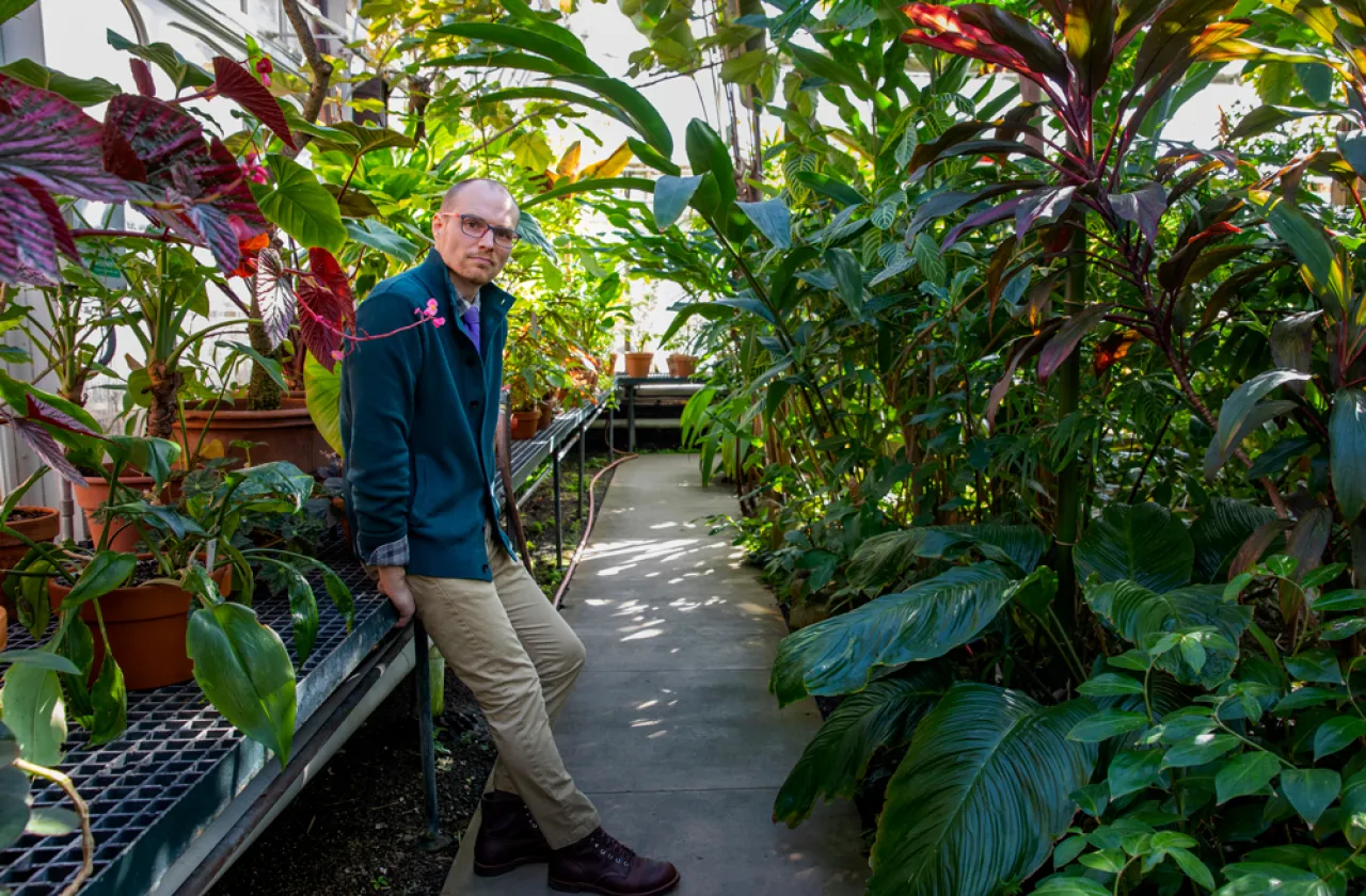 Tim Johnson in a greenhouse