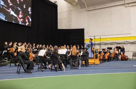Photo of choir and orchestra playing music in the ITT