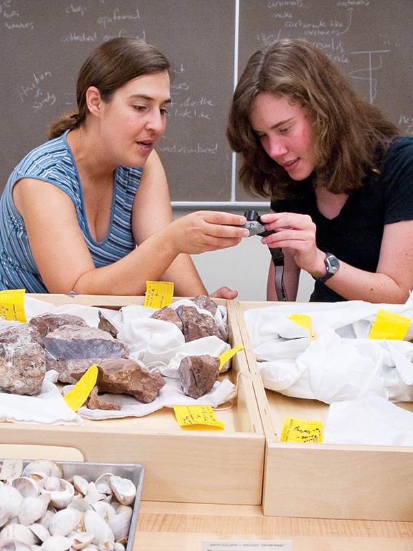 Sara Pruss and a student look at rock samples