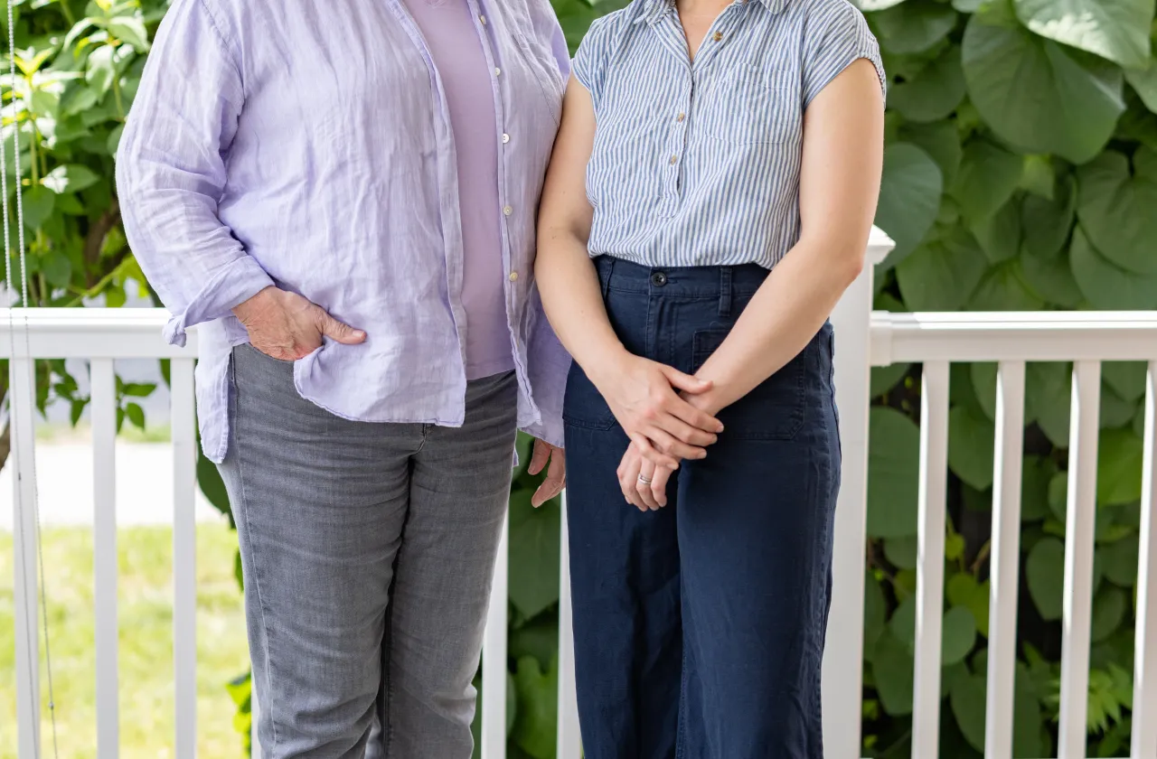 Suzanne Gottschang, the Kahn’s director and associate professor of anthropology and East Asian studies, and Kathleen Pierce, visiting assistant professor of art, stand in front of dark green leaves