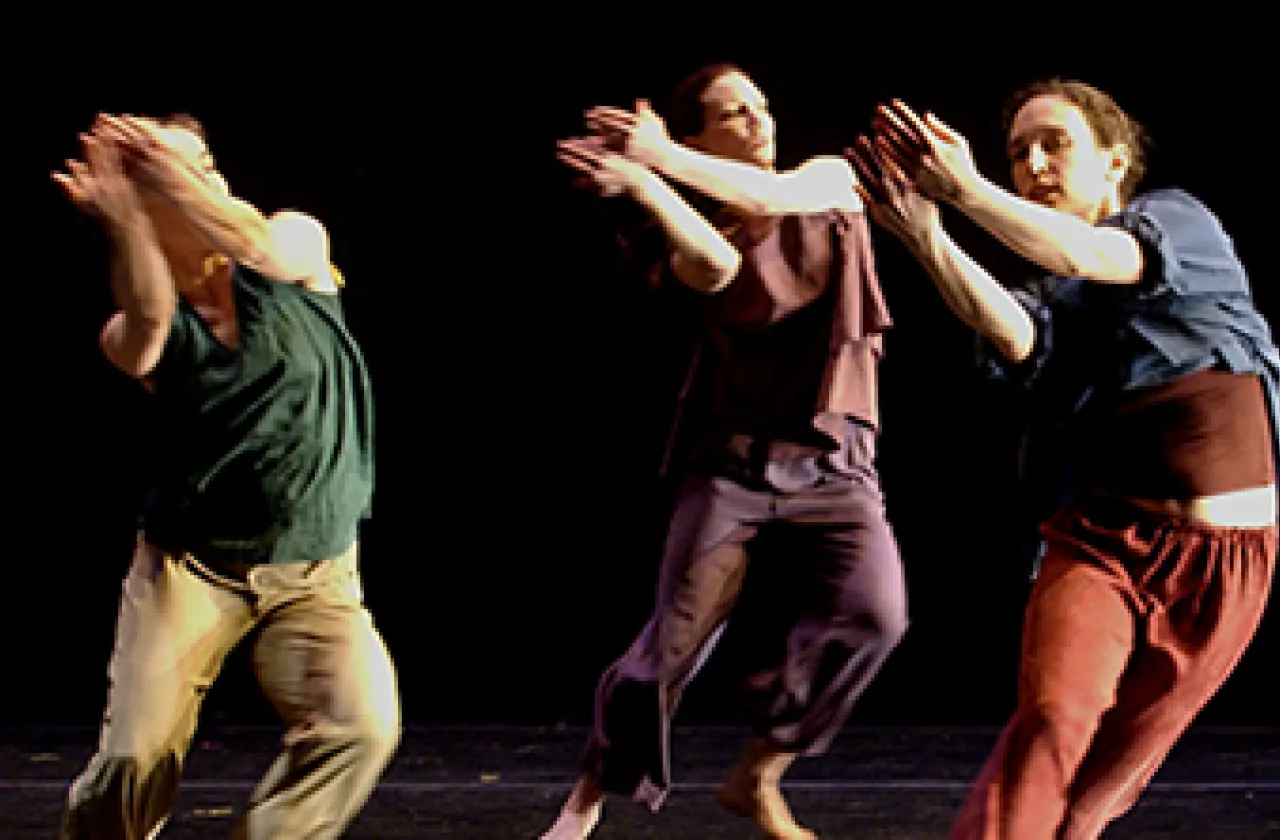 Three students in a dance performance