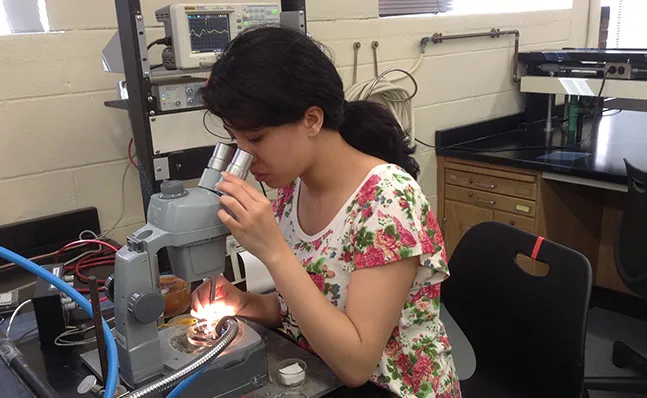 Student Kara at the microscope