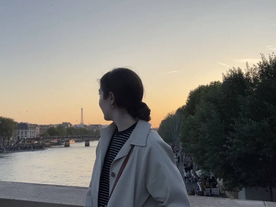 Nicole Papageorgiou ’24 looks away from the camera toward view in Paris, France