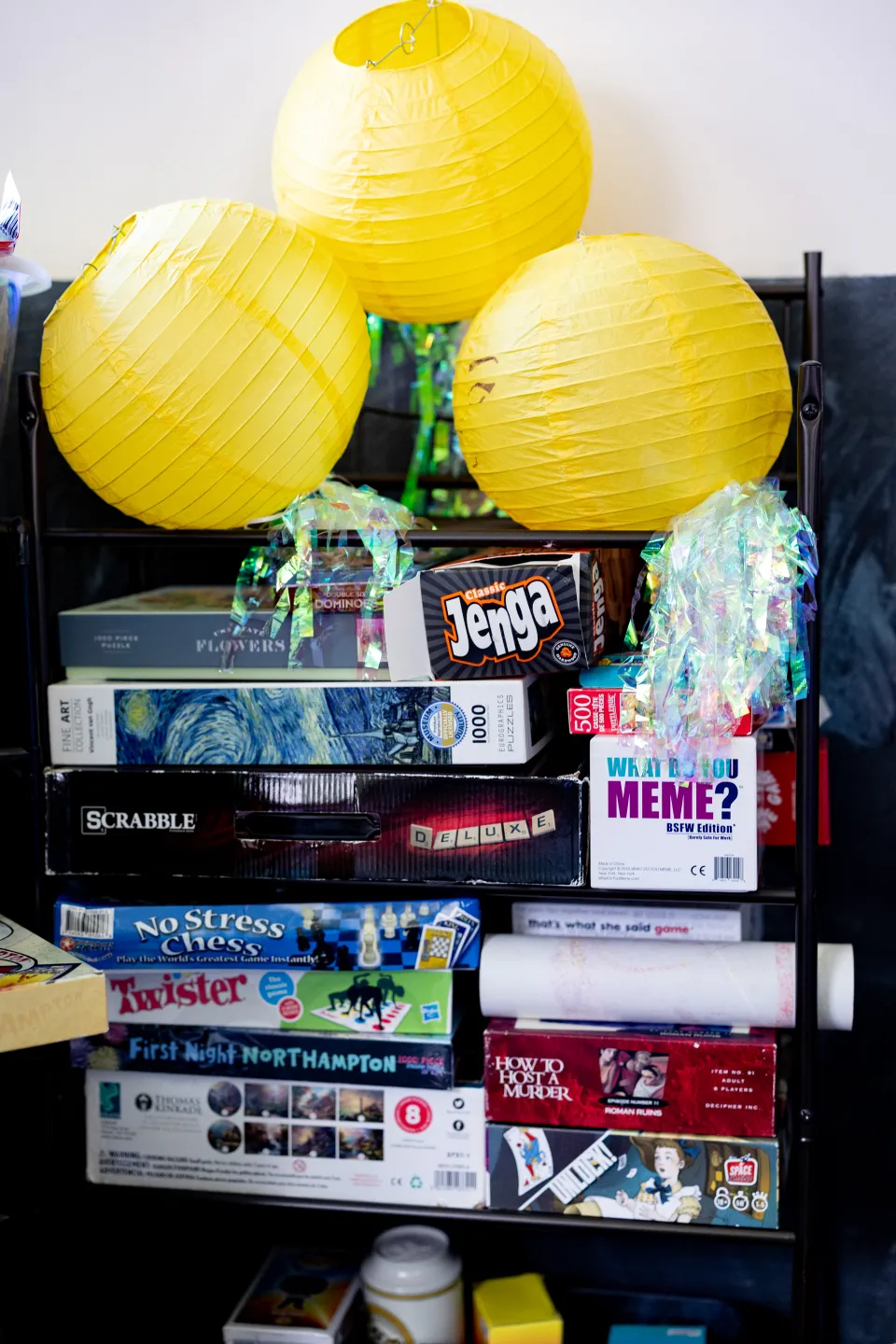 Board games, yellow paper lanterns and other decorations at SmithCycle in Scales House basement