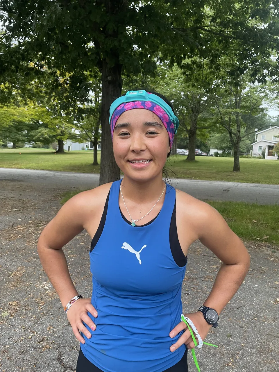 Nadira Talayee wearing a blue Puma top and headband after finishing her first ultramarathon